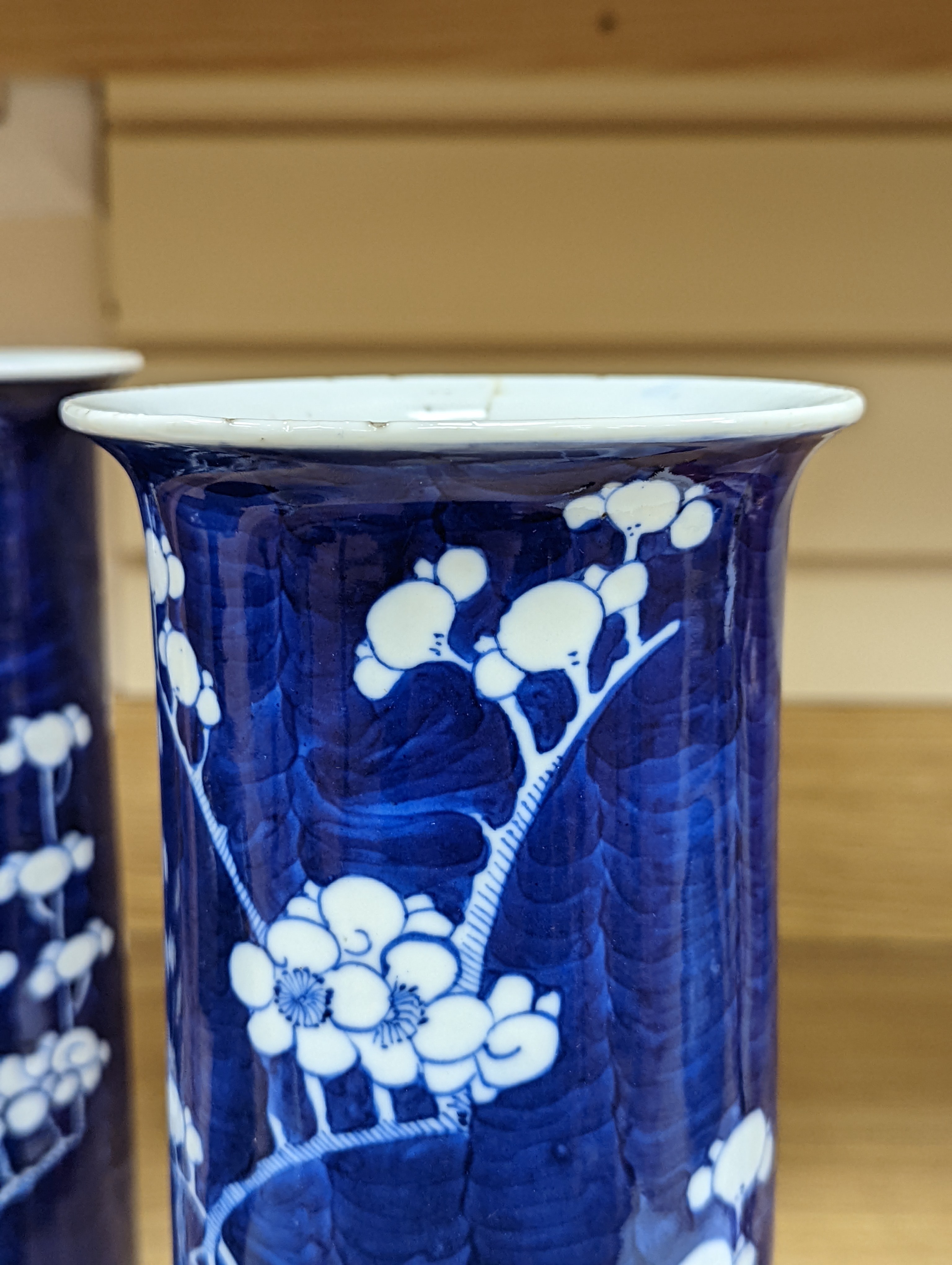 An 18th century Chinese famille rose mug, a Chinese Imari tea caddy and two Chinese blue and white sleeve vases 30cm (4)